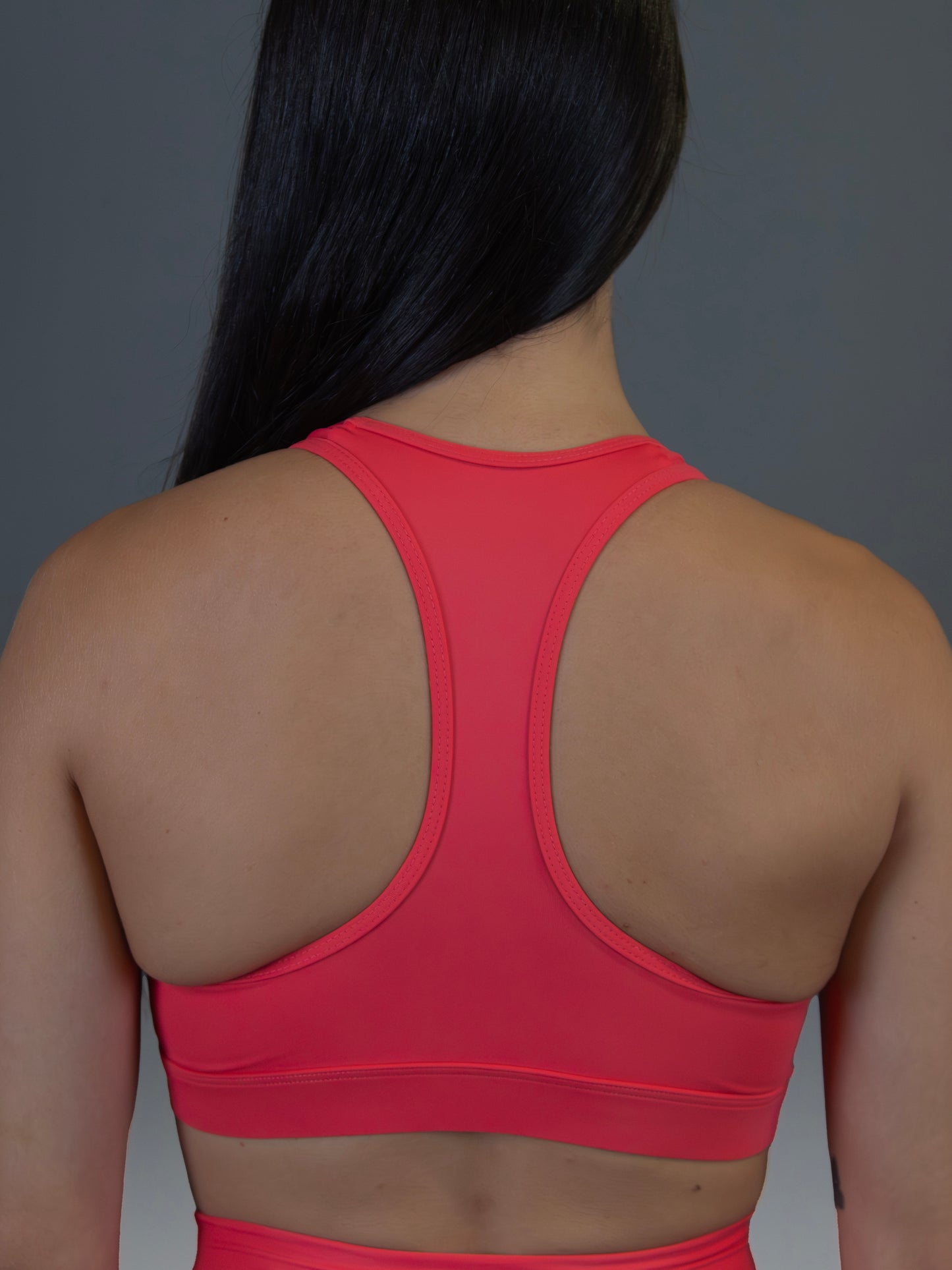 Top deportivo rojo salmón